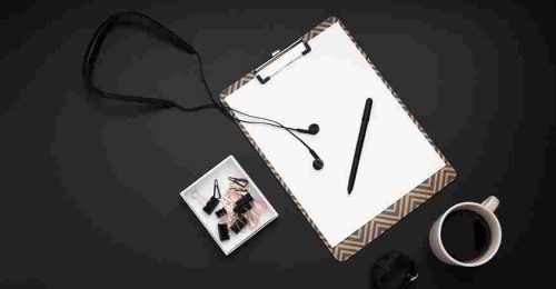 flat-lay-desktop-with-headphones-notepad_11zon
